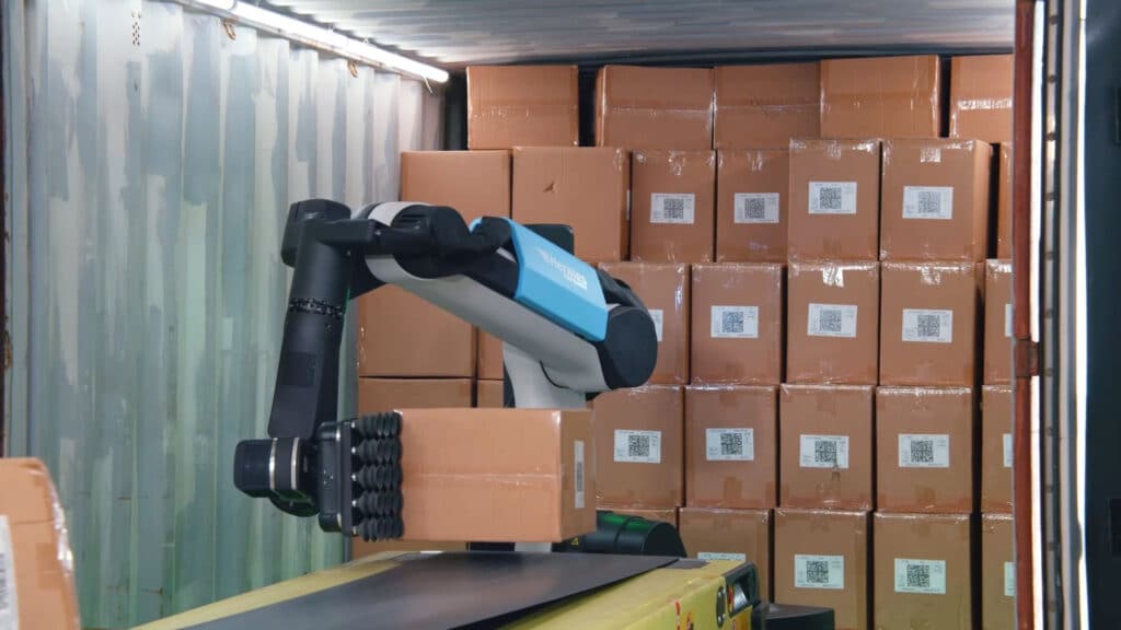 Boston Dynamics Stretch warehouse robot handling a case