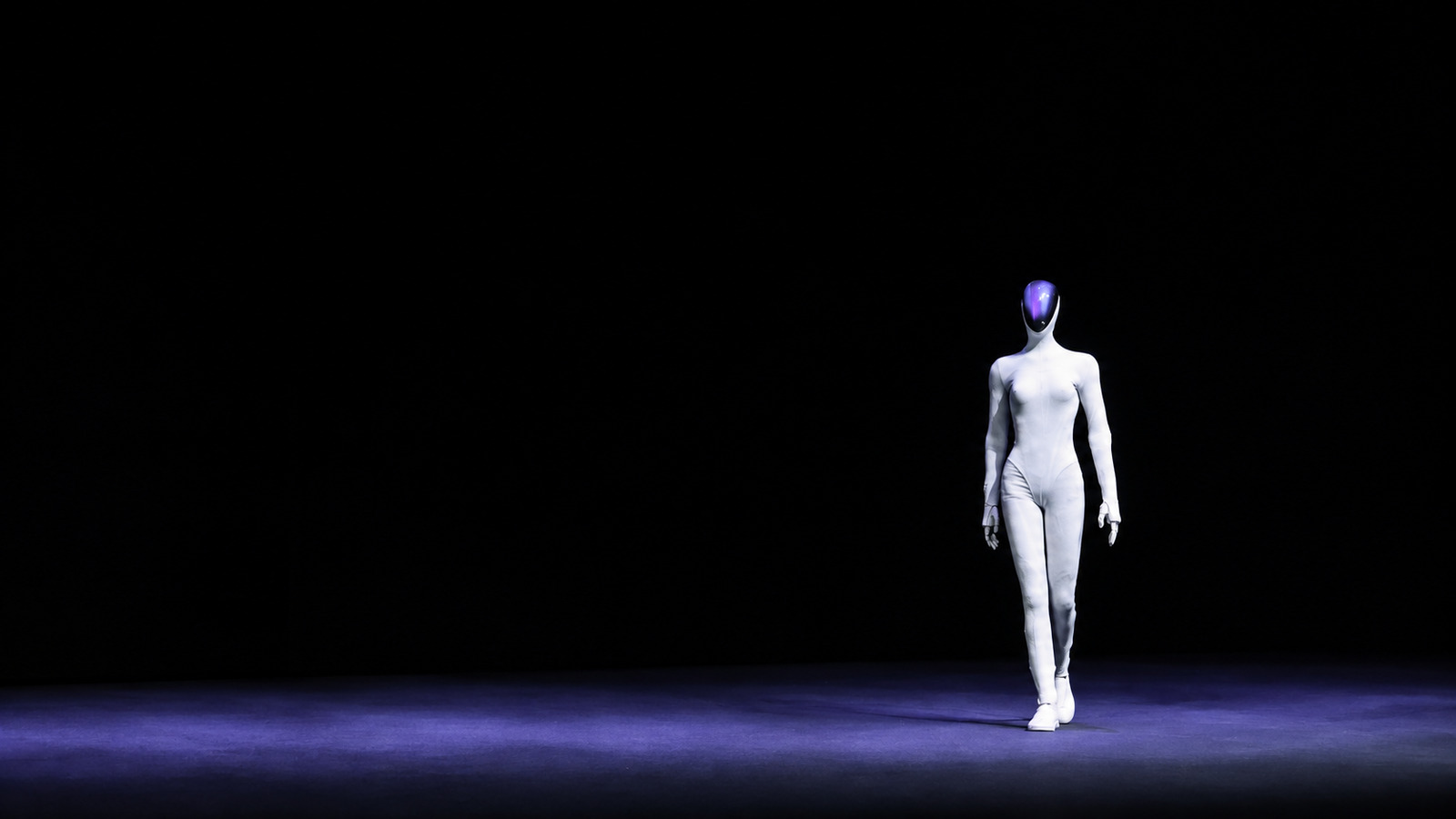 Editorial illustration of XPENG's white IRON humanoid walking on a dark stage